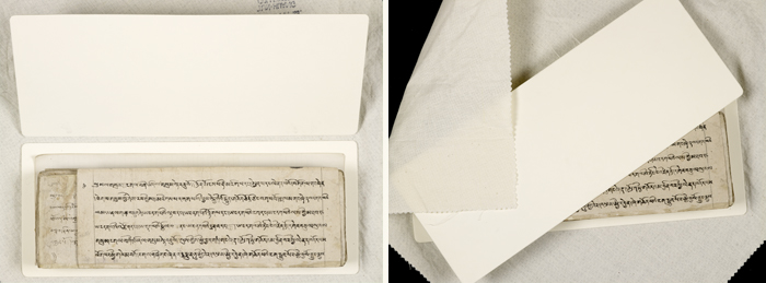 A pothi manuscript separated into individual sheets and placed in an archive box.