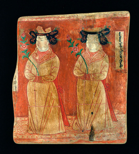 Brightly coloured wall painting of two female forms in matching robes, carrying plant stems. 