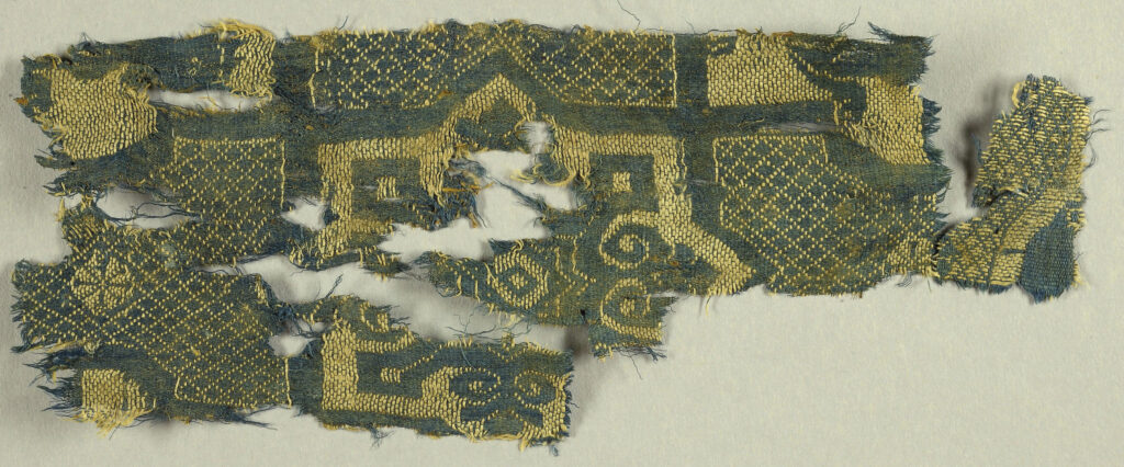 A piece of fragmentary patterned textile. 