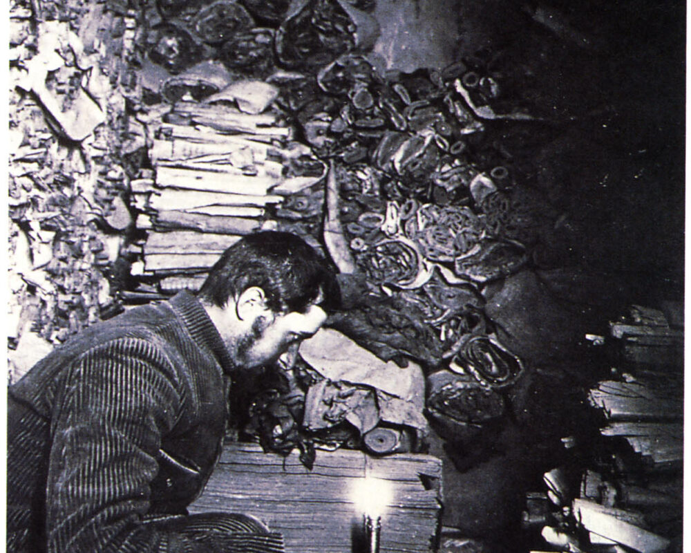 Archaeologist inside the cave using artificial light see objects.