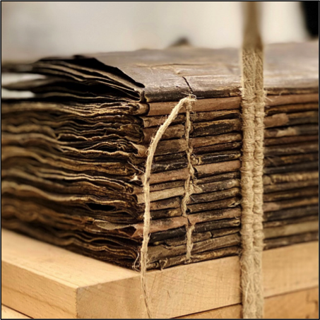 A pile of manuscripts wrapped in string