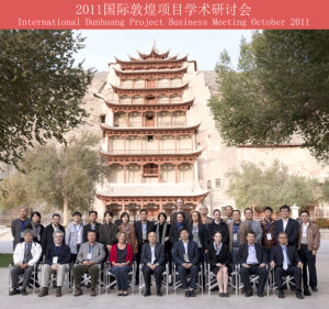 A group photograph taken in front of the famous pagoda built in front of Mogao cave 96.