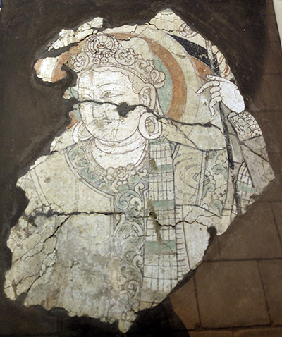 Fragmentary mural of a person's head and upper body.