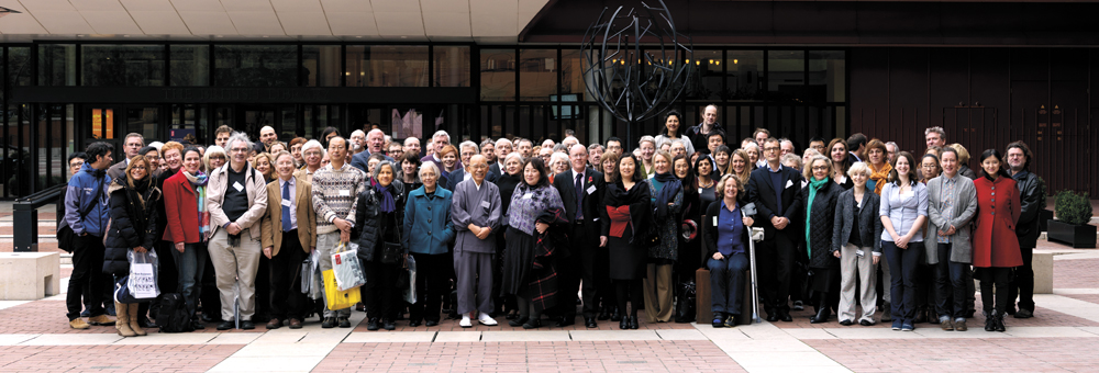 Large group of conference attendees photographed outside the British Library entrance.