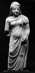 Statue of a female form, missing one arm.