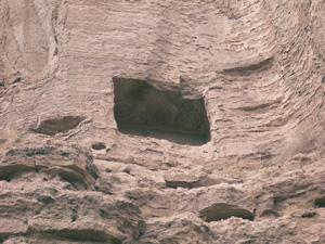 A cliff face with a square cave cut into it. 