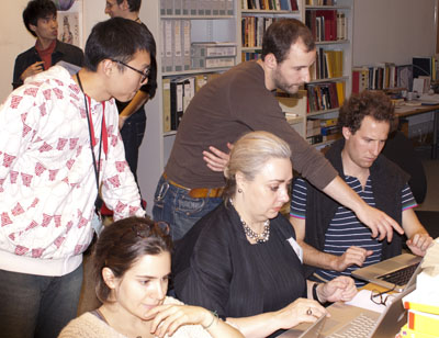 Students and collaborators in an office contributing to the Wikipedia editathon.
