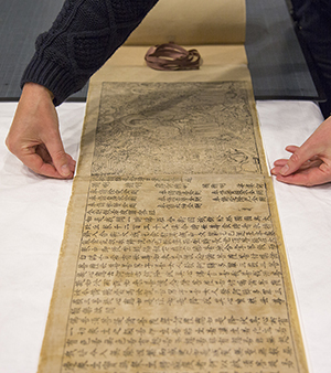 The printed Diamond Sutra laid out on a flat surface.