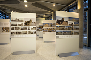 Photographs displayed in an indoor gallery space. 
