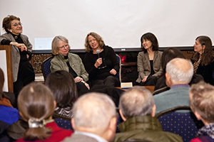 Colleagues at a workshop, taking part in a panel. 