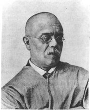 Headshot of Dudin, black and white historic photograph. 