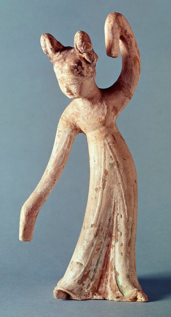 Small statue of a female figure in a dancing pose.