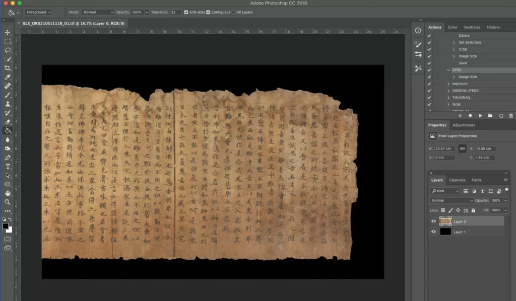 Computer screen showing the digitised image of the scroll in photoshop. 